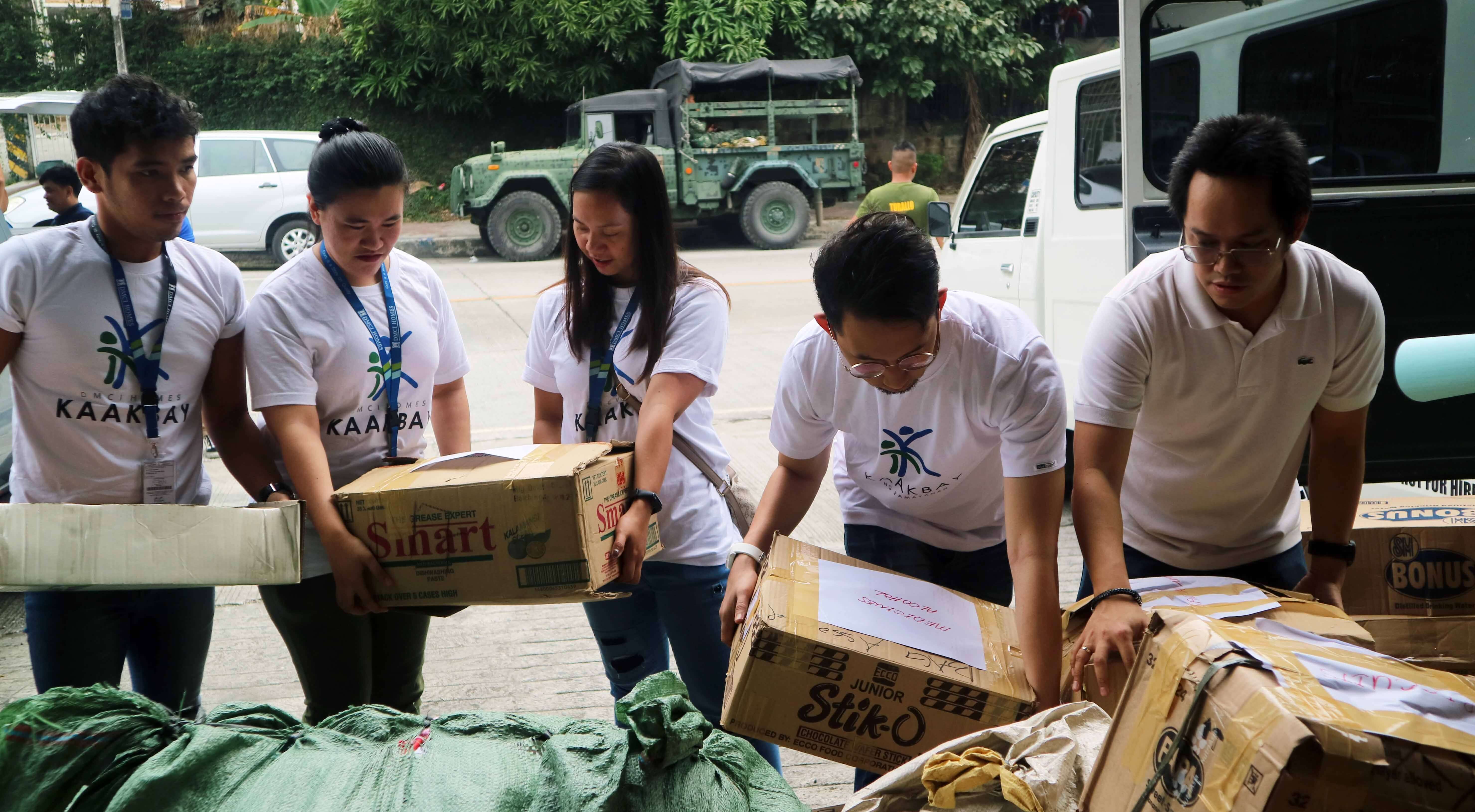 dmci-homes-employees-condo-residents-donate-goods-for-taal-1581065159246
